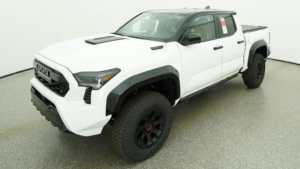 2026 Toyota Tacoma i-FORCE MAX TRD Pro in Ice Cap With Black Roof — front three-quarter view