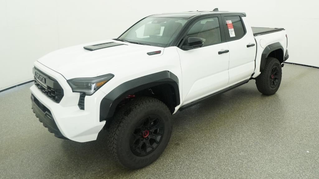 2026 Toyota Tacoma i-FORCE MAX TRD Pro in Ice Cap With Black Roof — front three-quarter view